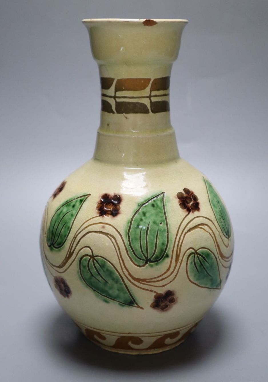 An Edwin Fishley, Fremington slipware vase with sgraffito decoration, incised marks, 23cm